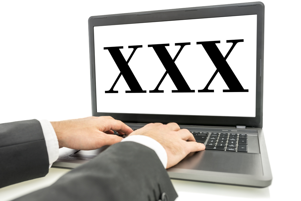 XXX written on laptop monitor on white background to represent Applying for Adult Entertainment Merchant Accounts