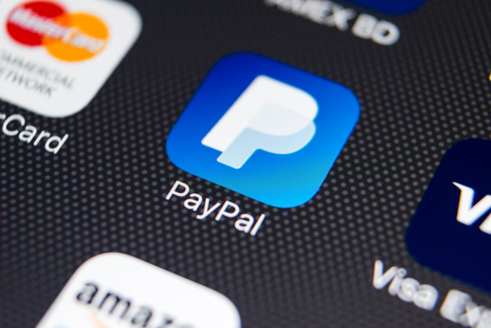PayPal application icon on smartphone screen close-up. PayPal app icon to symbolized High-Risk Merchants