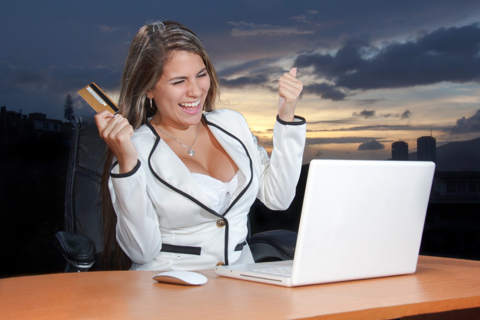 business woman holding credit card and using laptop computer. Ecommerce Payment Processing concept