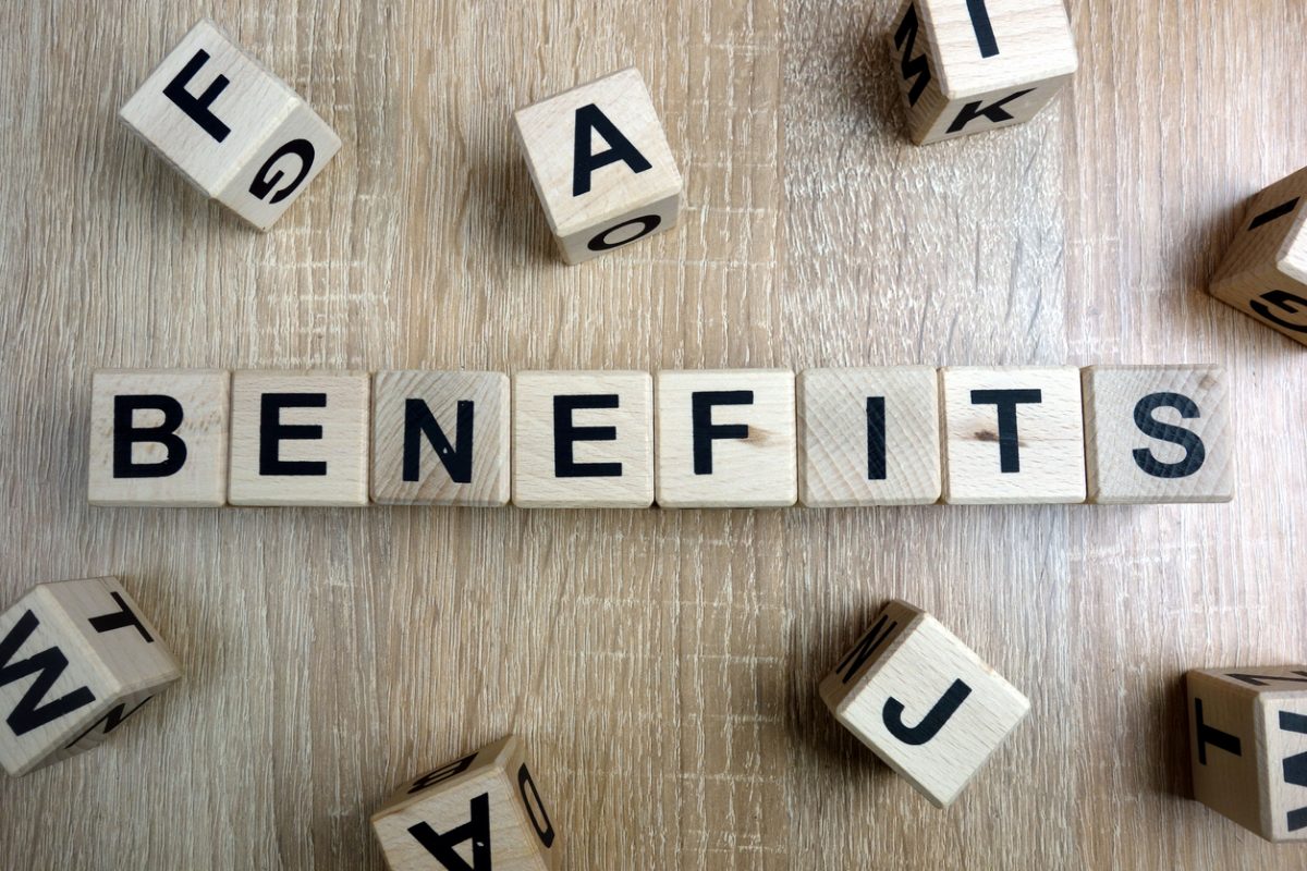  Wooden blocks spelling out the word benefits referring to the benefits of hotel merchant accounts.