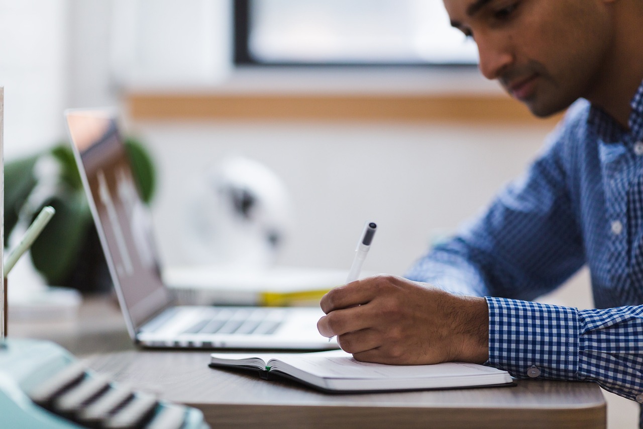 Man Writing Laptop Computer