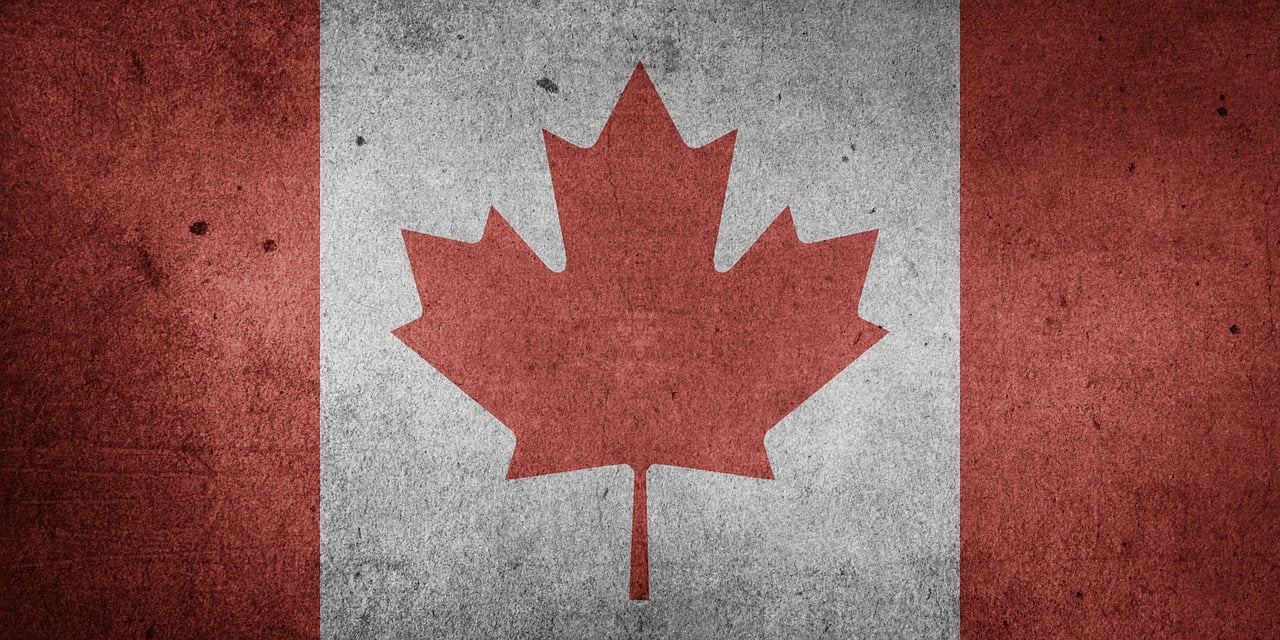The red and white Canadian flag with a maple leaf in the center