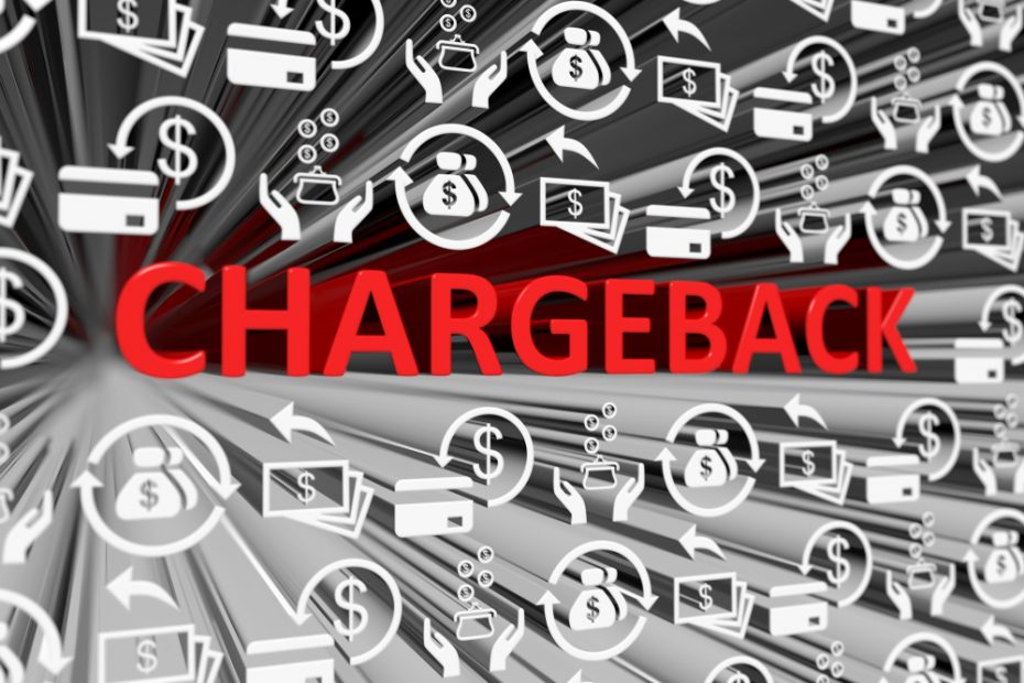 The word CHARGEBACK in red with blurred background showing payment solutions.