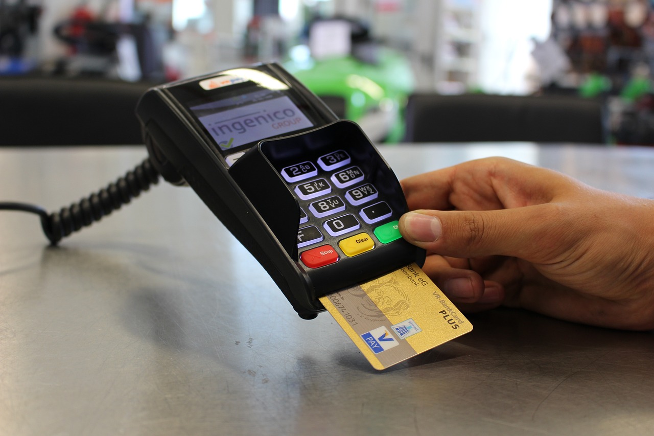 A merchant processing a bank card payment. 