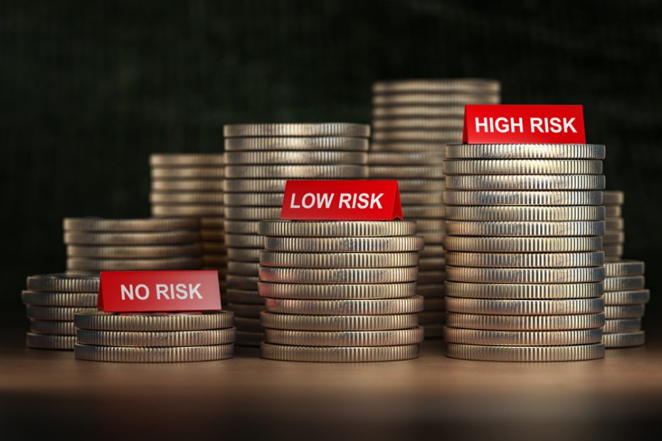 Three stacks of coins; the tallest one says "high risk", the middle says "medium risk" and the lowest says "low risk".