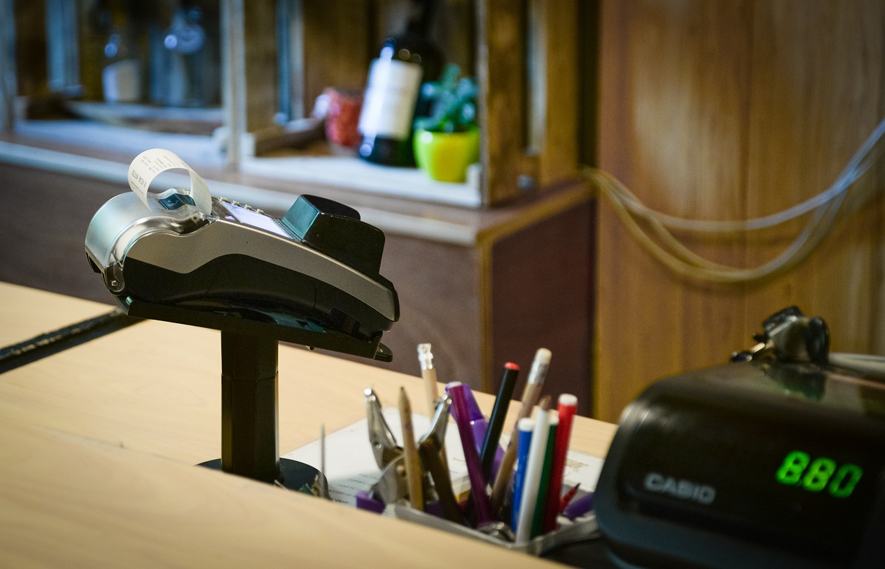 A cash register and a payment terminal inside a business. 